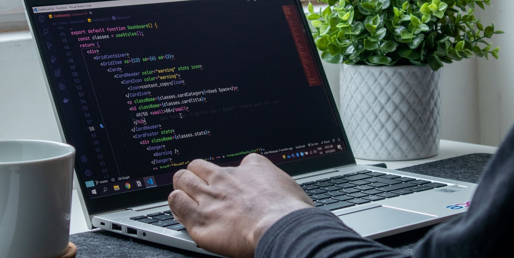 Developer working on code in a modern development environment